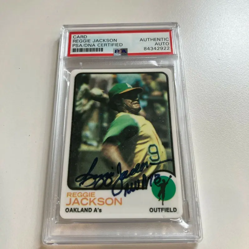 1973 Topps Reggie Jackson 1973 MVP Signed Porcelain Baseball Card PSA DNA